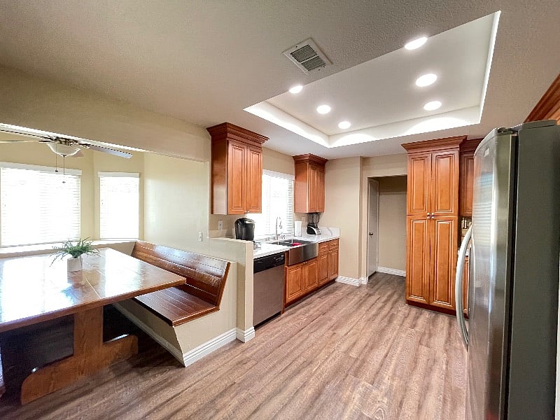 Large built-in table with direct sight lines to kitchen