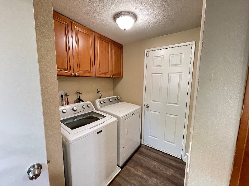 Laundry room downstairs off the garage entrance by 1/2 bath