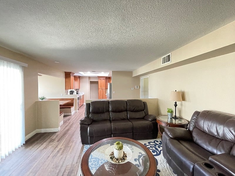 Back sitting room with back door slider to backyard