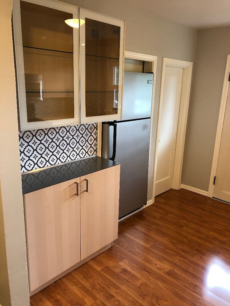 Full size fridge and smooth close glass cabinets and walk in pantry