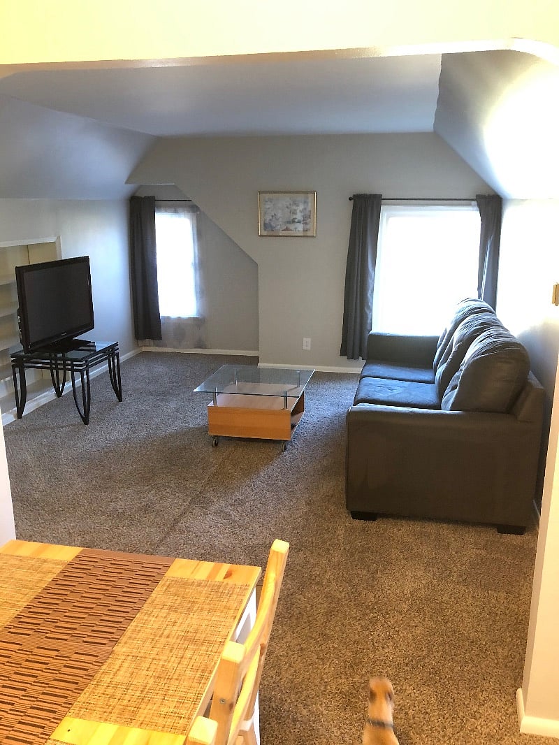 Living room with park view, high speed fiber Wi-Fi, flatscreen TV. Small closet for storage not shown.