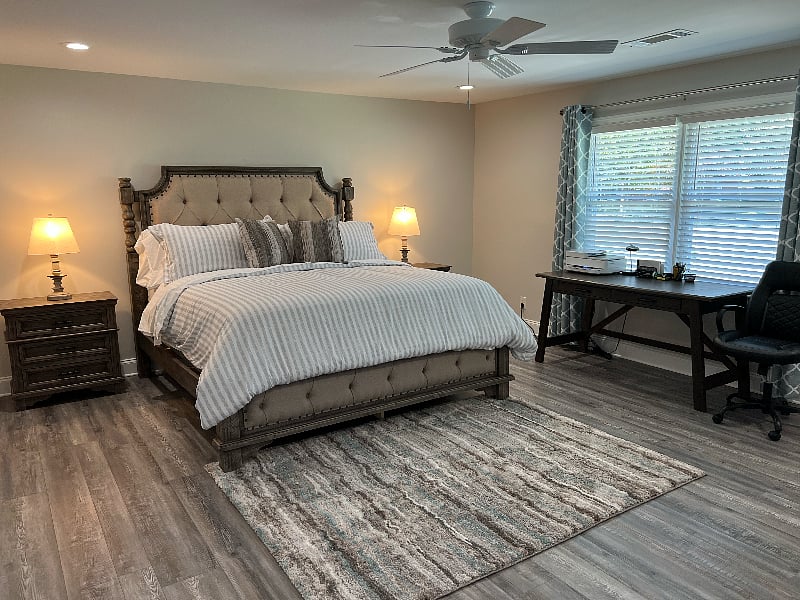16ft x 18ft Bonus Master Bedroom w/King Bed. Orthopedic Mattress. Lamps & nightstands on both sides. Plenty of linens, pillows, blankets.