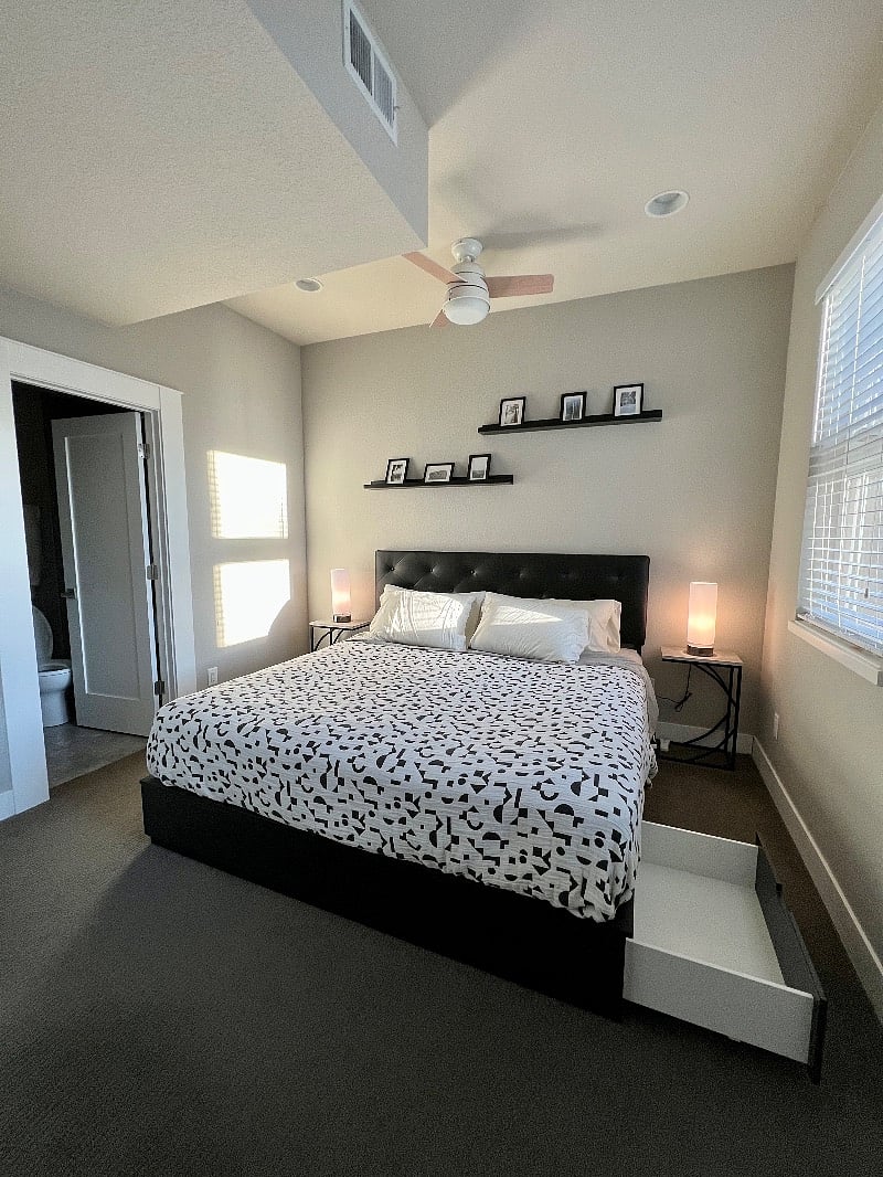 Master bedroom includes closet and drawers on bed frame