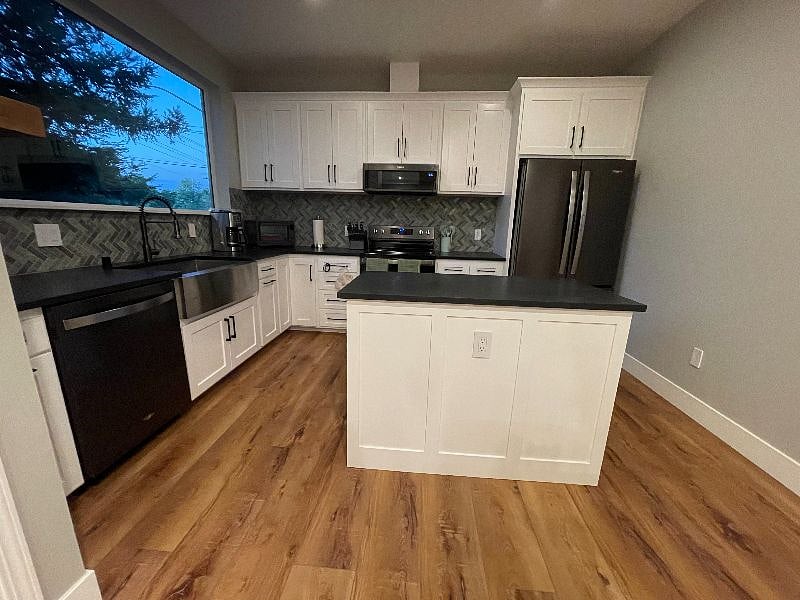 Full sized kitchen equipped with everything you need, including Ninja blender and toaster oven/air fryer.