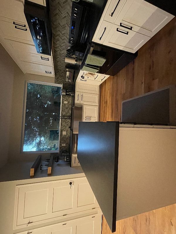 Enjoy the gorgeous view out of the massive kitchen window as you cook.