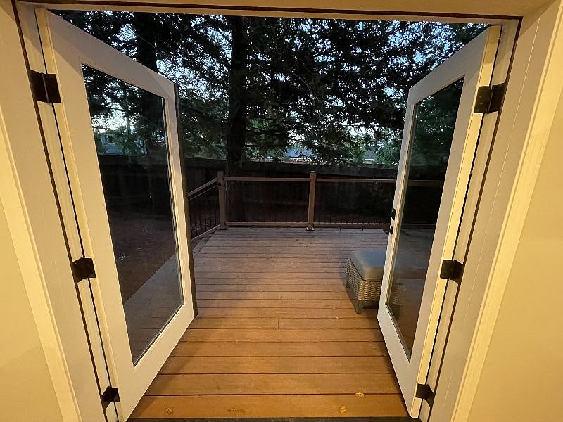French door exit onto your own private deck. These are great to open when you want to get air flow into the house. You can even watch TV from the deck if you pull the TV out on its mount and turn it.
