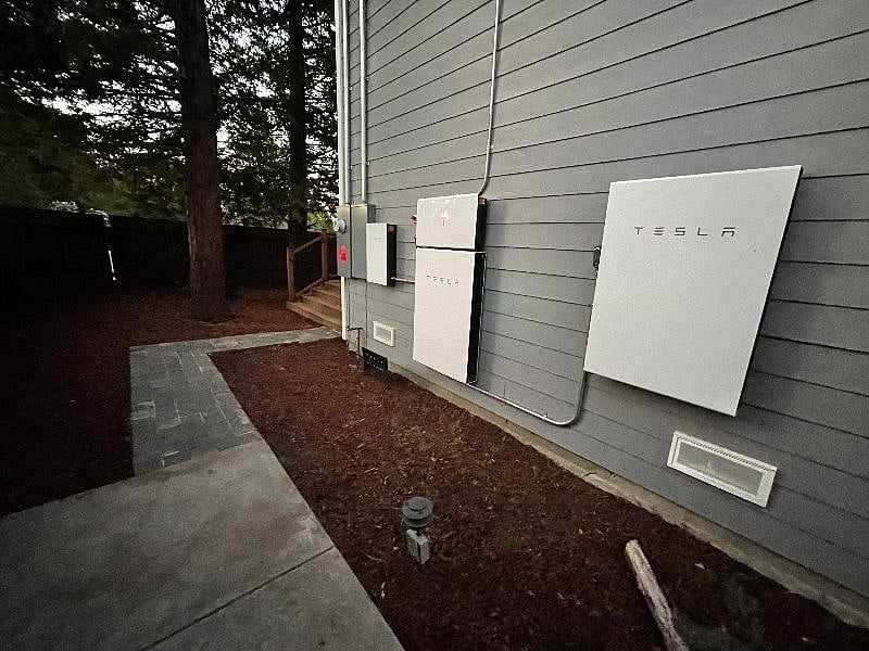 Side of the house has the Tesla solar power walls (batteries) and control switches, which power the entire property. This will take you mostly off the grid and prevent power outages during black- or brown-outs.