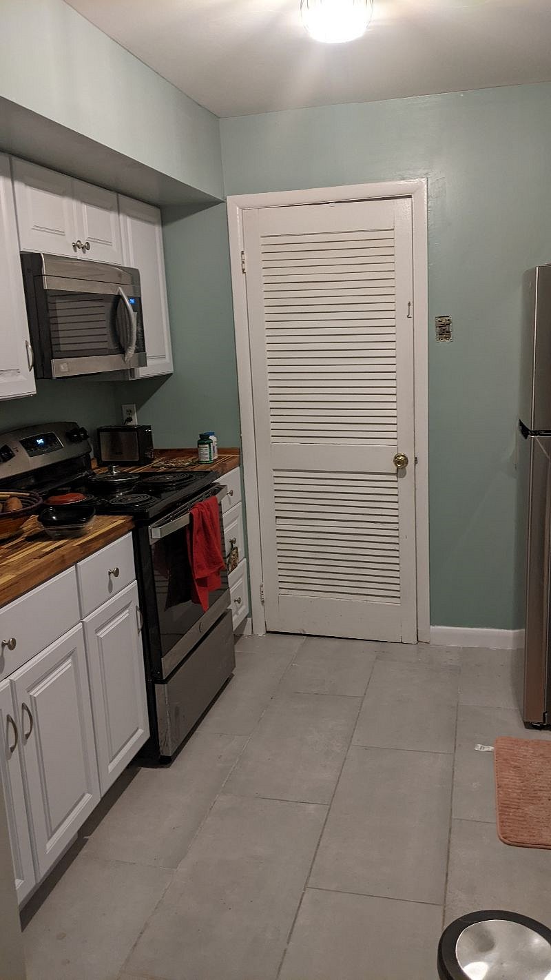 Simple kitchen with the necessary items: fridge, toaster, microwave, range, dishwasher. (air fryer coming soon)