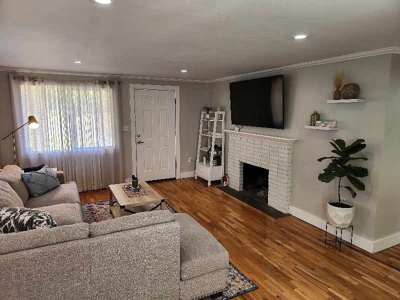 Large living room with Smart TV and comfortable sectional