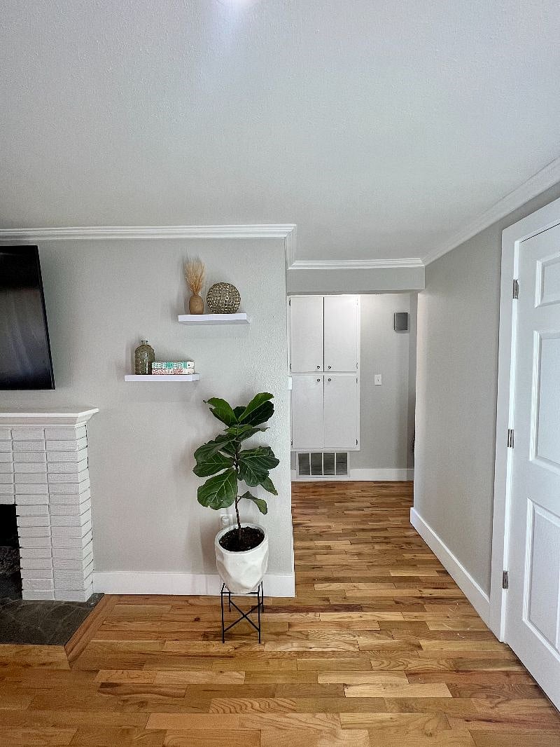 Living room that leads to bedrooms, bathroom, and laundry