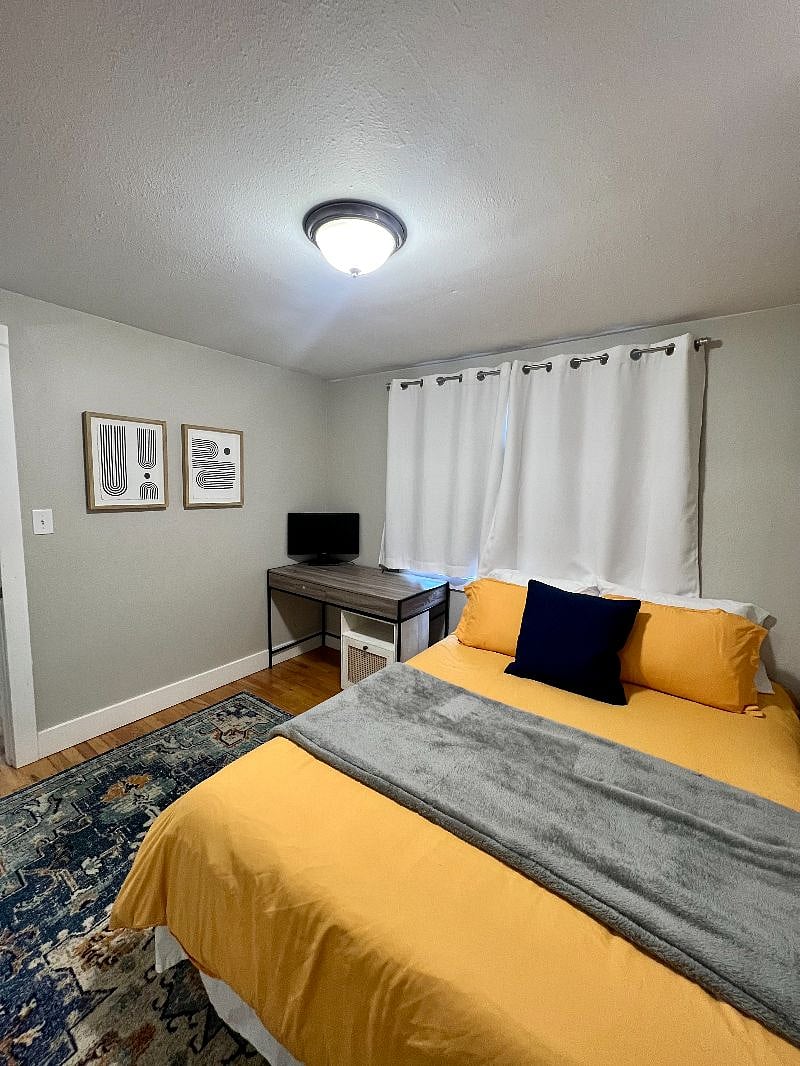 Second bedroom with work from home setup (desk chair included but not pictured)