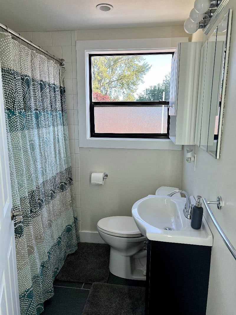 Bathroom with a full tub