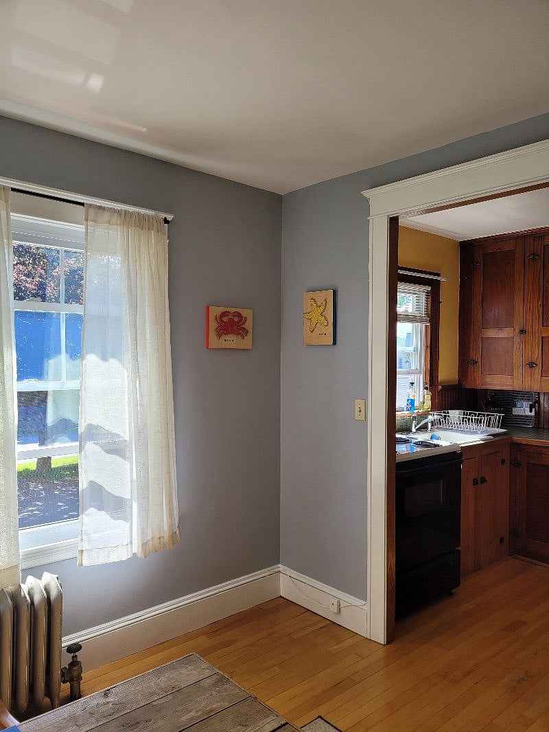 Looking from the dining area into the kitchen. Original string art is by a friend on one of the Casco Bay Islands.