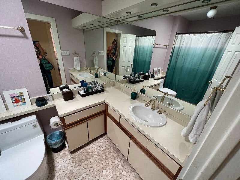 Cleaning supplies and storage under the cabinets. Large mirror. Night light.
