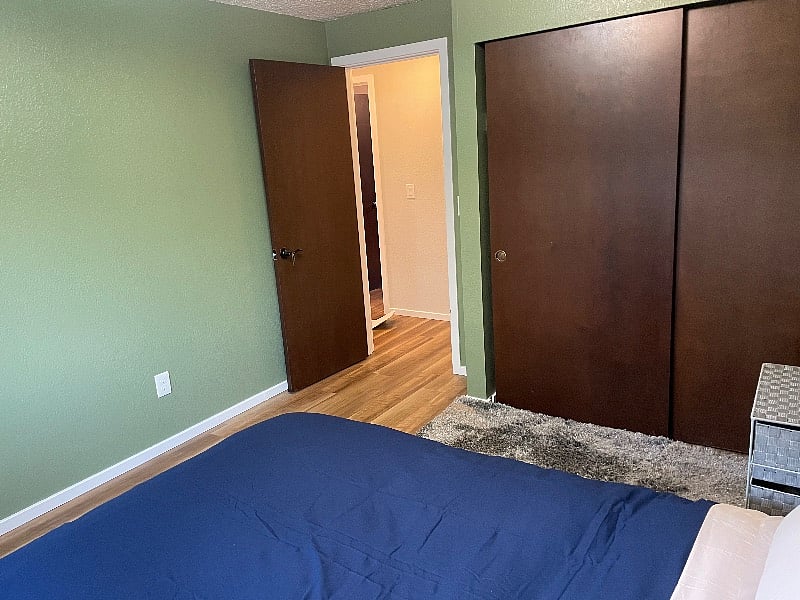 view from the room of entryway and built in closets.