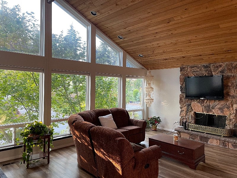 Main great room featuring the TV viewing area and coffee table