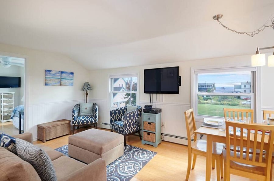 Second level unit living room and dining area with the ocean view. 