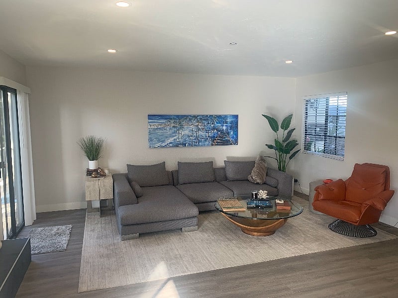 downstairs living room with 65" smart TV