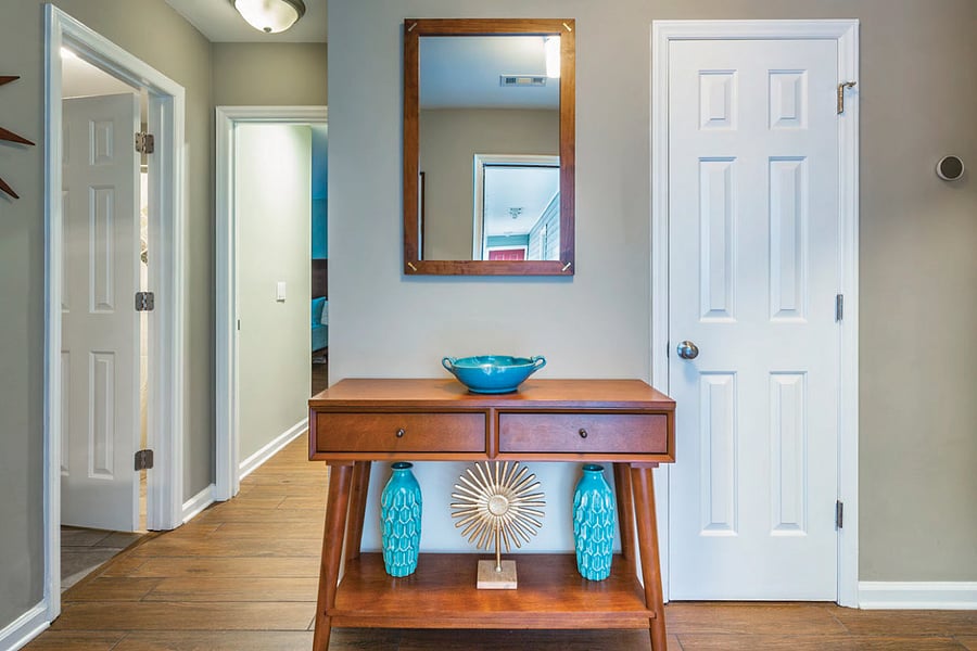 Entryway - left are bedrooms and hall bath. To the right is living area and kitchen.