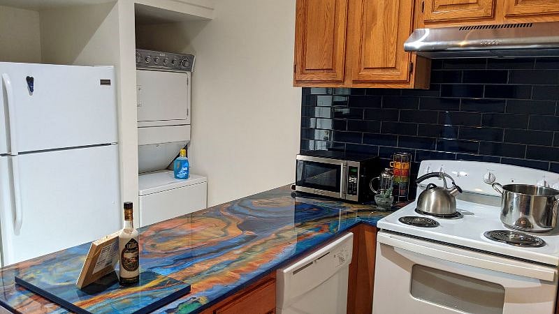 The stacked washer dryer is so convenient. The full size refrigerator is right next to it.