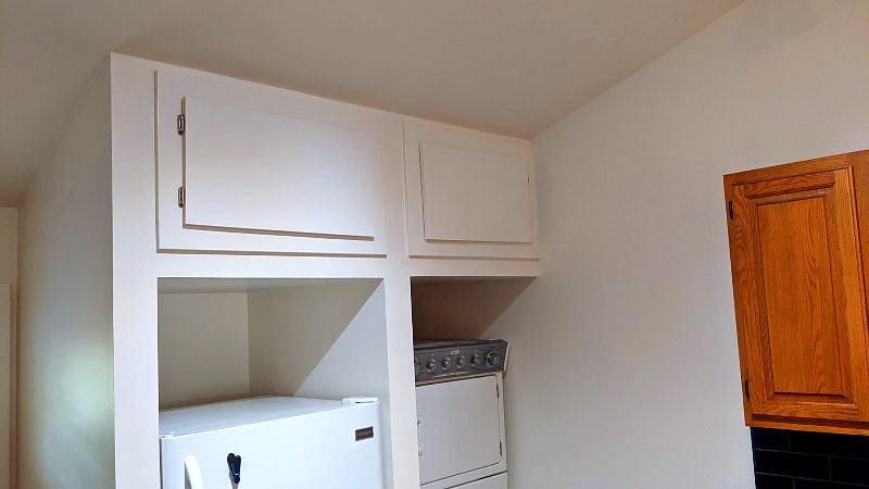There is storage above the refrigerator and washer/dryer.
