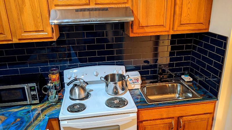 Fully stocked kitchen, stove and dishwasher.