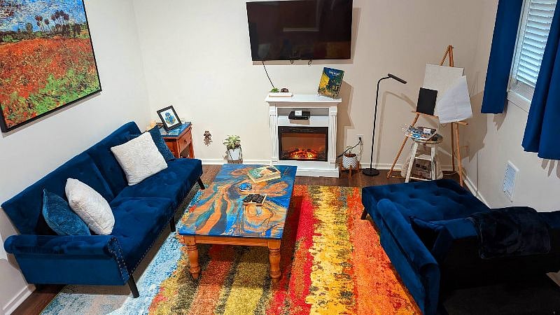 Just relax by the electric fireplace, with built in heater.