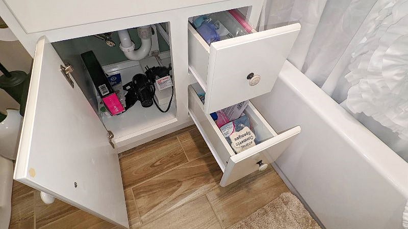 A hair dryer and curling iron are provided for your convenience.
