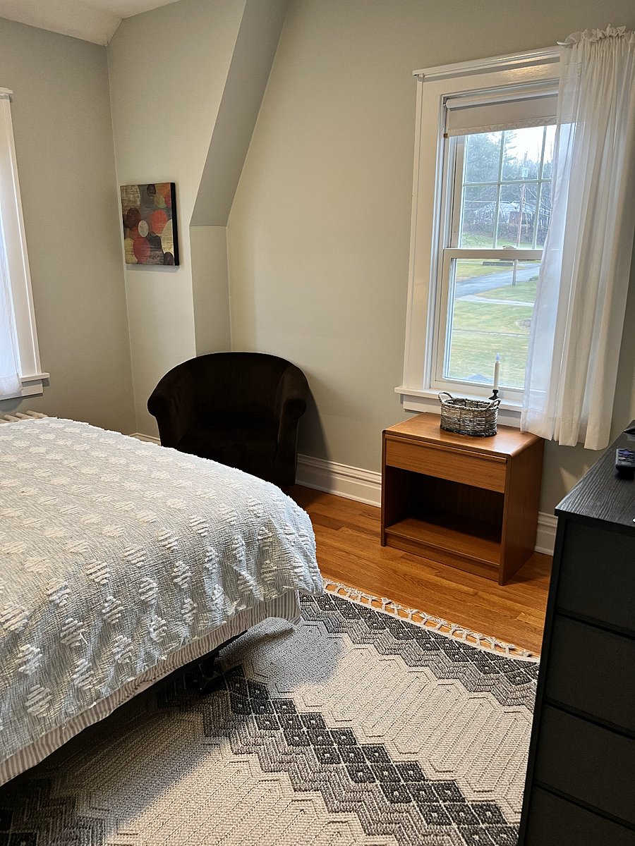Room includes darkening shades.