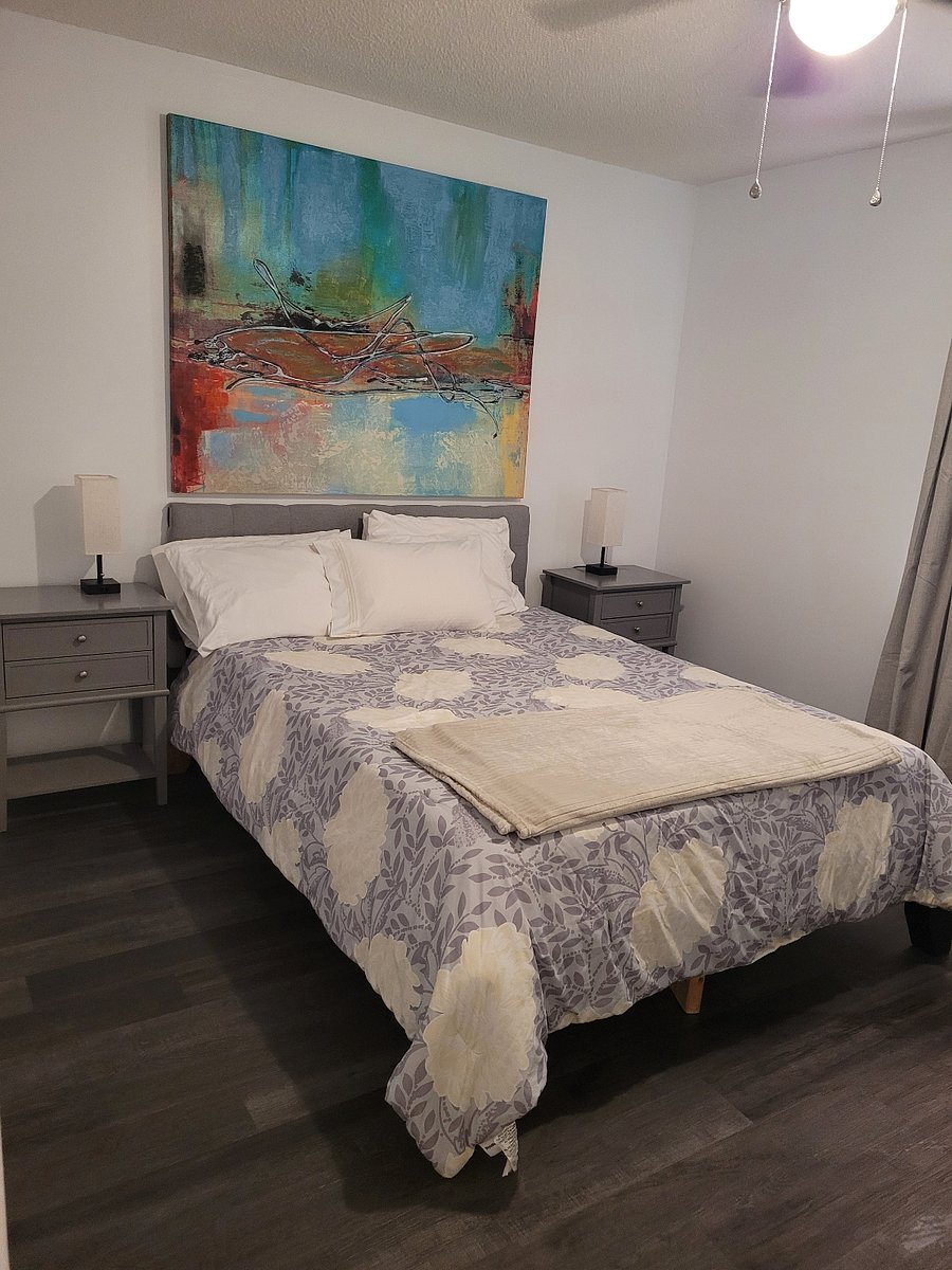 2nd bedroom with new LVP flooring. Built-in USB charging in headboard.