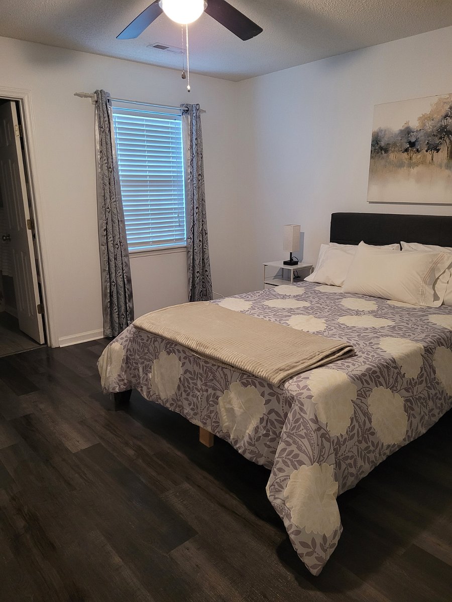 Master bedroom with new LVP flooring. Built-in USB charging on nightstands.