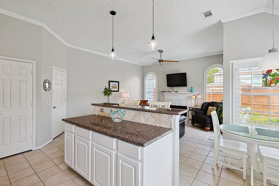 view of kitchen island looking into family room