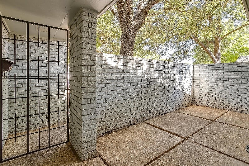 Old real estate photo of empty courtyard.