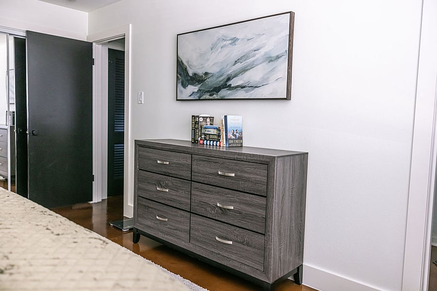 Fully furnished Primary Bedroom with Puffy King mattress, and 50 Samsung Smart TV (not shown).
