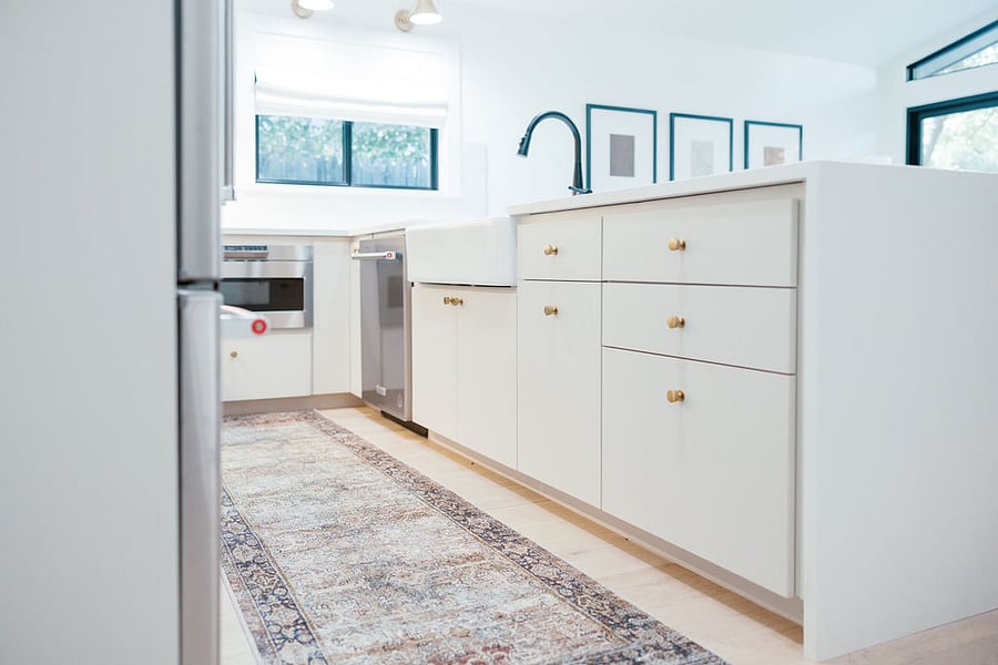 Kitchen - Sharp under-counter microwave, custom soft-close cabinetry, touch-less faucet, Kitchenaide Silent dishwasher.