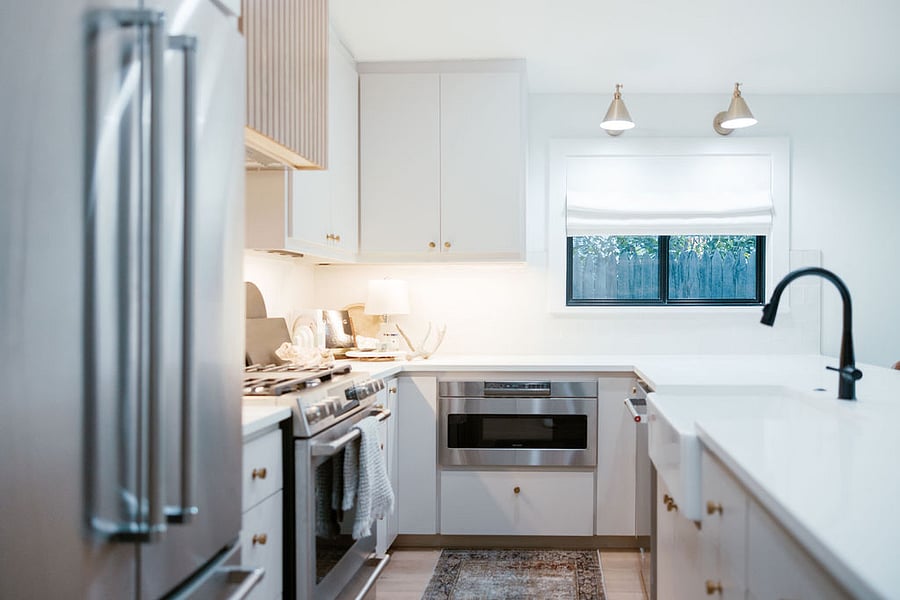 Kitchen - Sharp under-counter microwave with automatic motorized door.