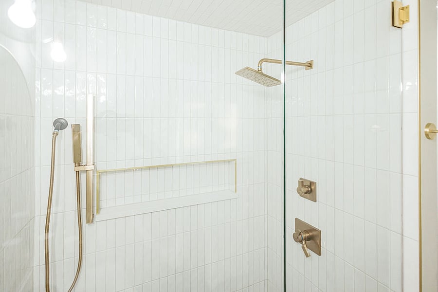 Primary en-suite bathroom with large, luxurious walk-in shower.