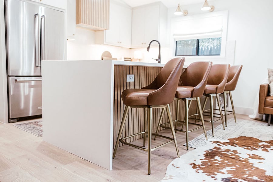 Large peninsula quartz countertop comfortably seats four.