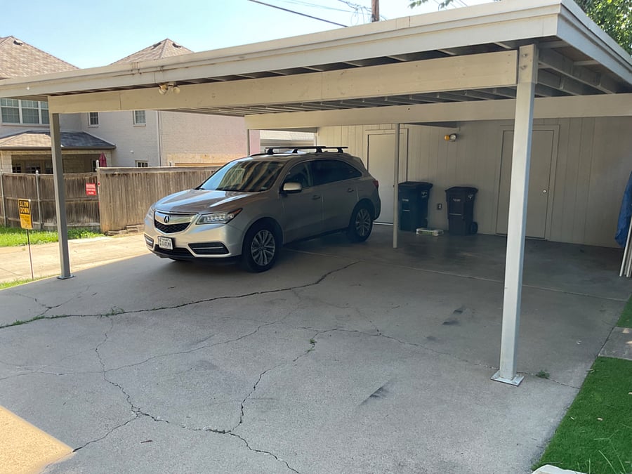 Carport with locked storage room.