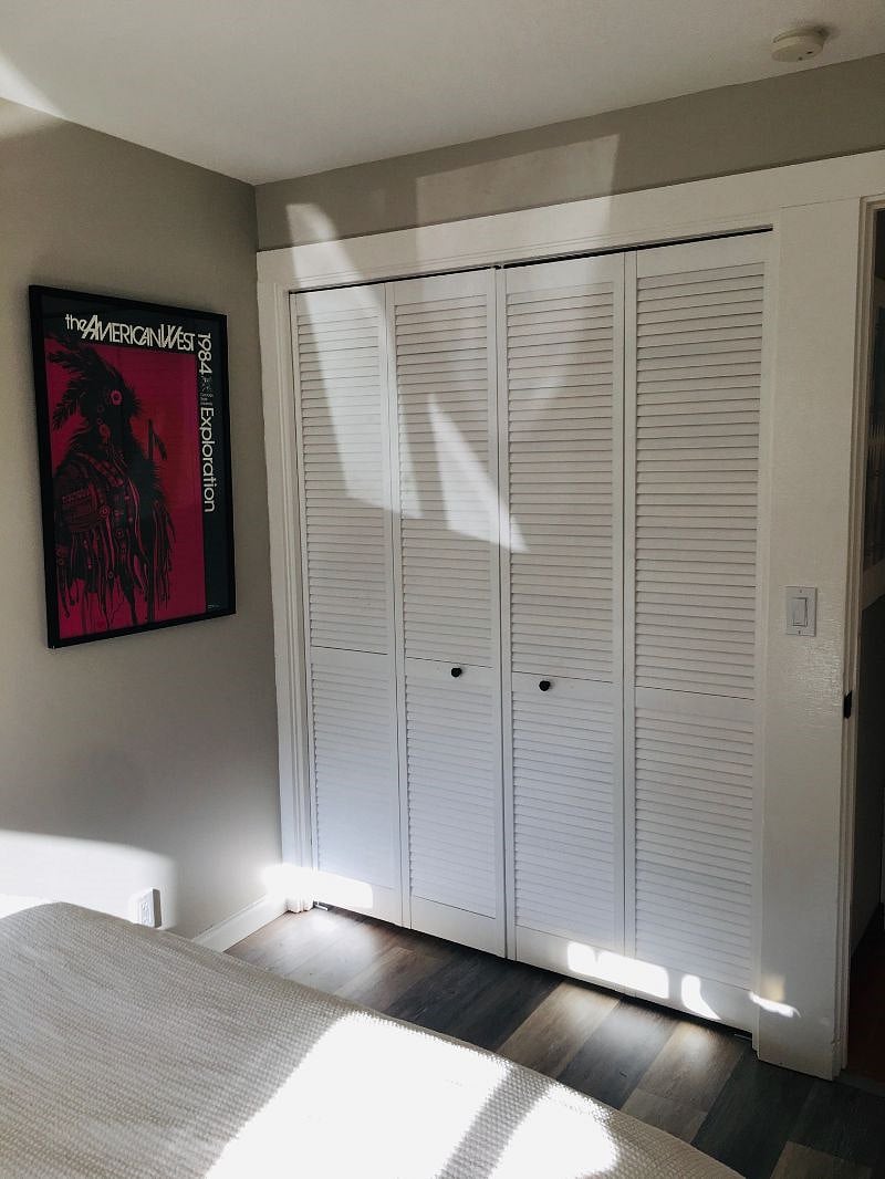 Closet with dresser inside.