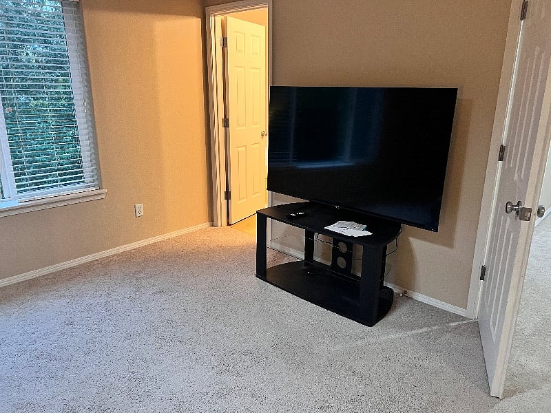 master bedroom with 65' smart TV