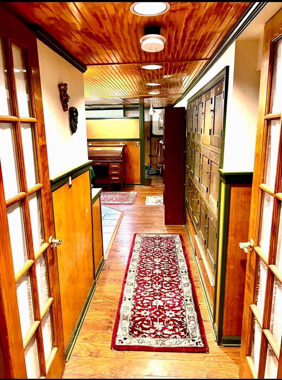 Entry into the apartment.  Kitchen to the left, 2 office areas directly in front, cool storage (biology lockers  repurposed from University of Michigan) to the right 