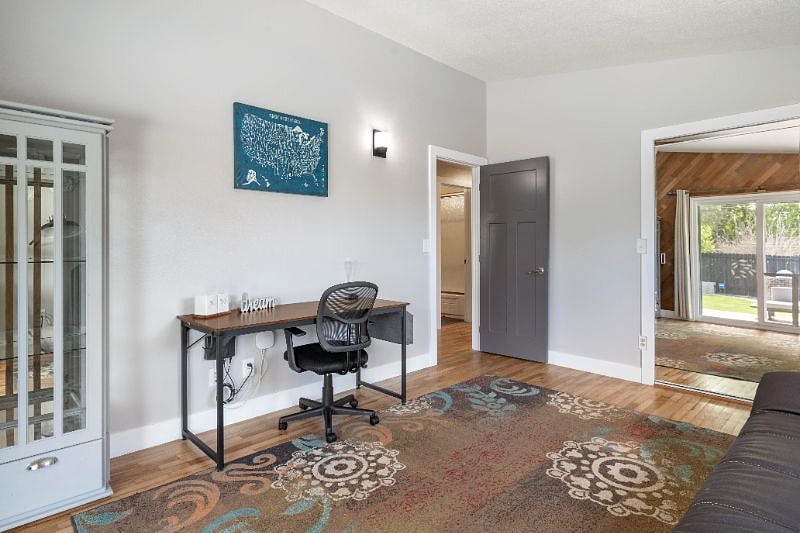 3rd Bedroom,  with desk and access to the backyard. 