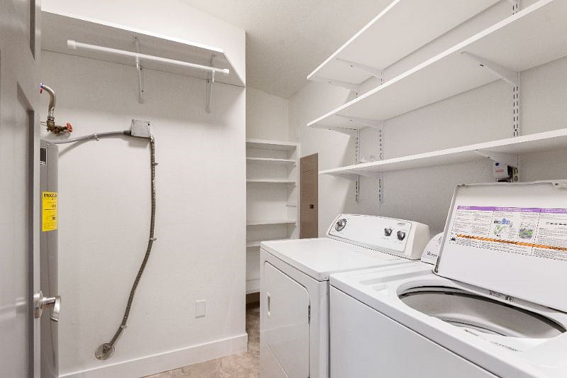 Laundry room,  with shelving for pantry storage and hanging space