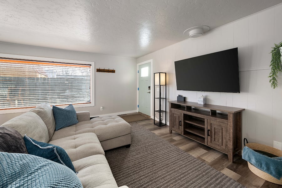 Cozy living room, couch extends our for ultimate relaxation. 58" Smart TV