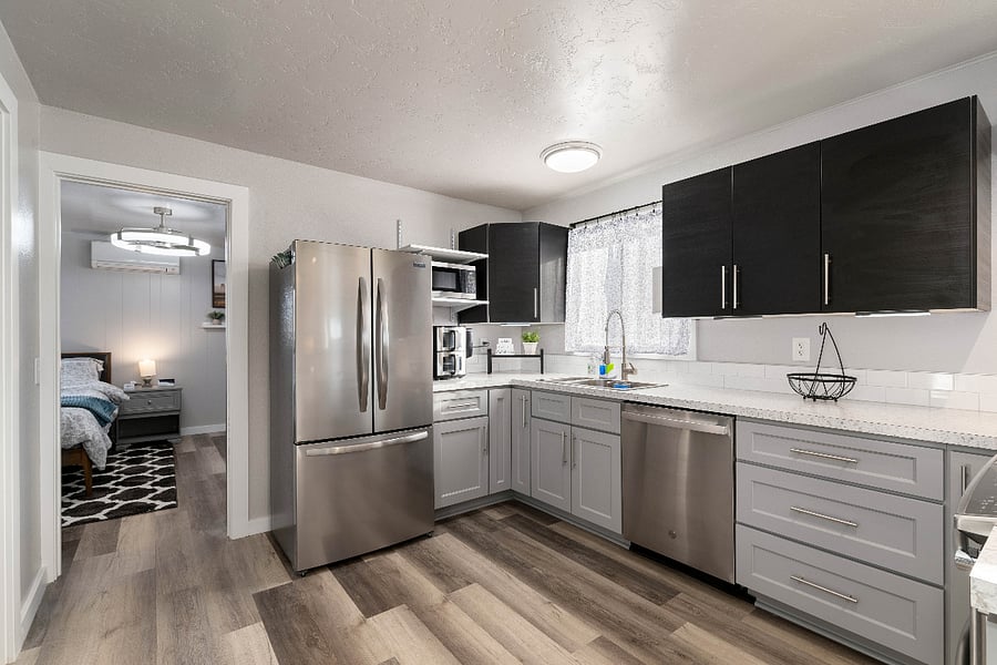 Fridge with icemaker, dishwaser, mircowave, airfryer and more kitchen accessories in pantry.
