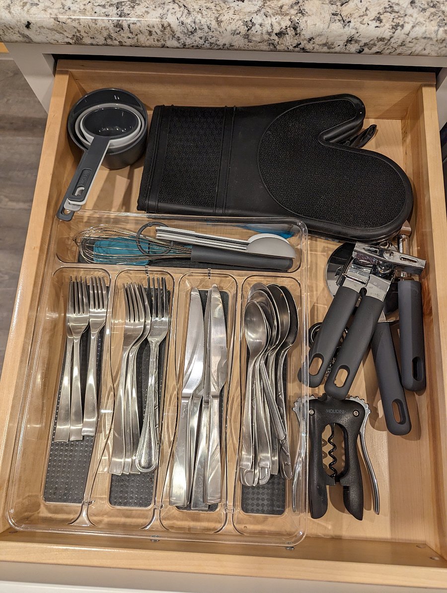 Variety of flatware and kitchen tools.