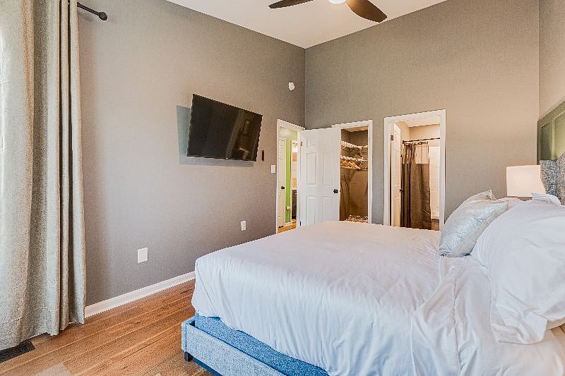 LARGE Master bedroom, with a king sized bed. Helix Midnight Mattress, hospitality grade linens, black out curtains, 50" Smart TV, attached bathroom, walk-in closet