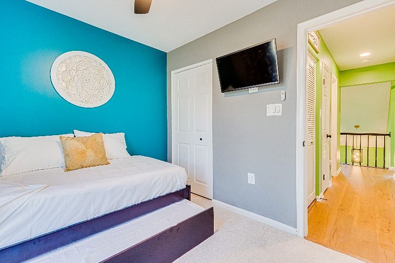 Our "Jewel" room with a twin sized bed + twin Trundle, both w/ Green Tea Mattresses and hospitality grade sheets, 32" Smart TV