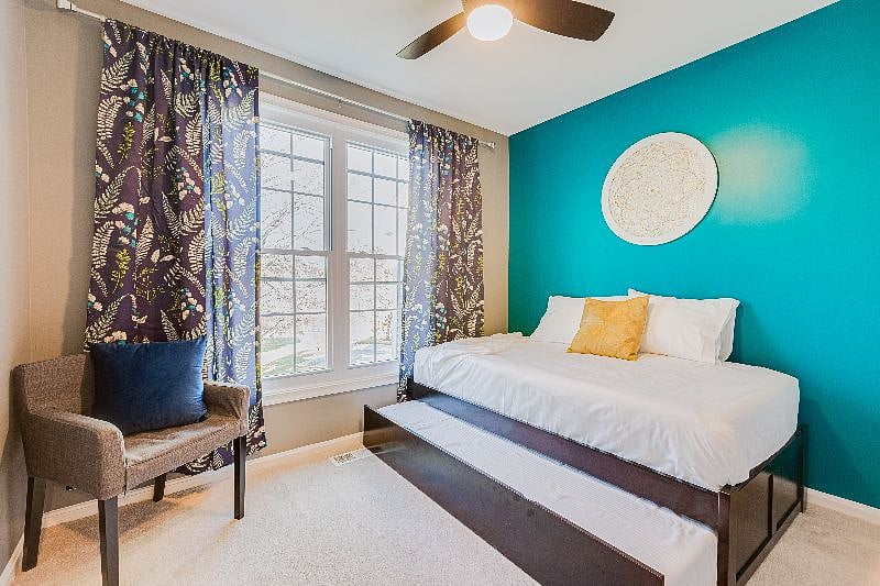 Our "Jewel" room with a twin sized bed + twin Trundle, both w/ Green Tea Mattresses and hospitality grade sheets, 32" Smart TV